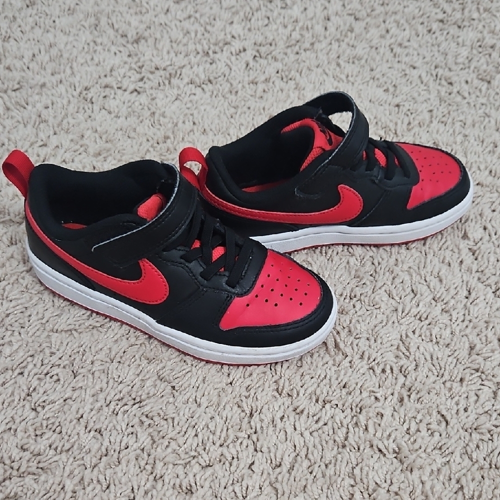 Nike Black and Red Sneakers with Basketball-Inspired Design